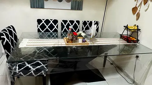 Glass Top Dining Table with 6 Patterned Chairs - Good Condition