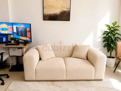 Cream 2-Seater Sofa in Good Condition - Modern Curved Design