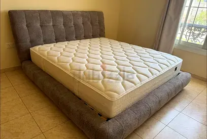 Grey fabric upholstered bed frame with orthopedic mattress — King size