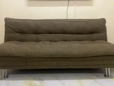 Compact convertible sofa bed in brown fabric — good condition