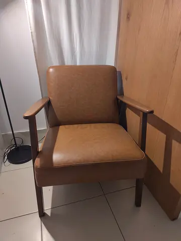 Wooden armchair with brown leather look upholstery