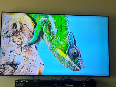 60-inch LED Smart TV in excellent condition, wall-mounted