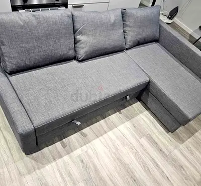 Grey L-shaped sofa with storage - good condition