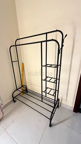 Black metal freestanding clothes rack with shelves - good condition