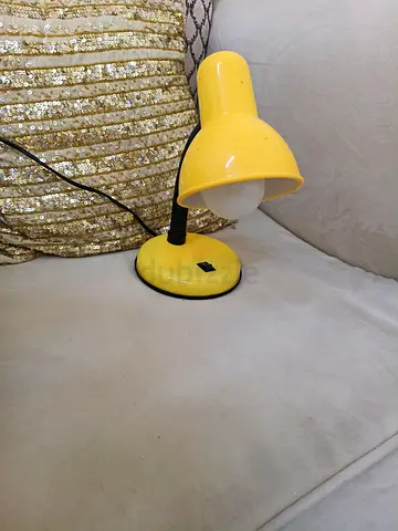 Small yellow bedside/desk lamp . Comes with led lamp.