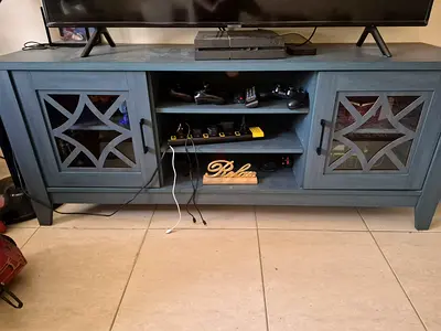 Dark green wooden TV cabinet