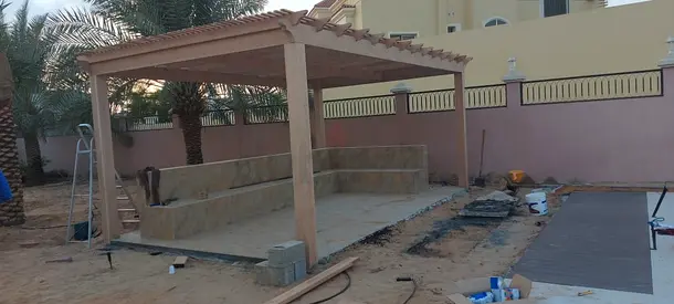 Wooden pergola with built-in stone seating — outdoor garden structure