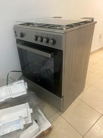 Brand new Hoover freestanding gas cooker with electric oven