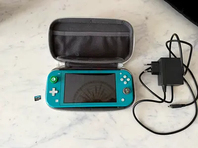 Nintendo Switch Lite Turquoise + 64GB SD Card & Accessories