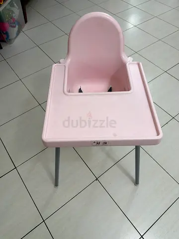 Used pink plastic baby booster/high chair insert with tray