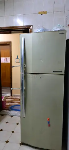 Used top-freezer refrigerator in working condition - 2 doors