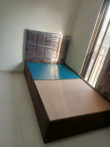 Single wooden bed frame with headboard -