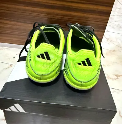 Used Adidas neon green indoor soccer shoes, size 38.5