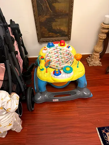 Baby activity walker / jumper with toys - good condition