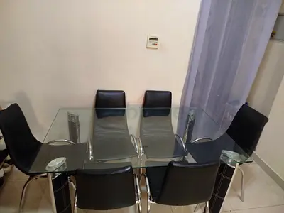 Glass Top Dining Table with 6 Black Chairs - Good Condition