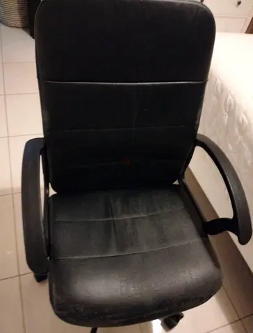 Used black office chair with armrests and wheels - comfortable seating