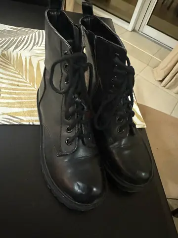 Black lace-up leather boots, gently used