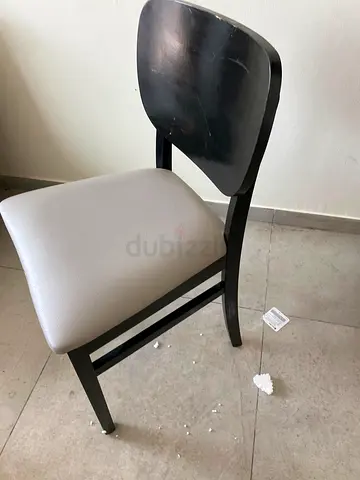 Black wooden dining chair with grey seat — good used condition