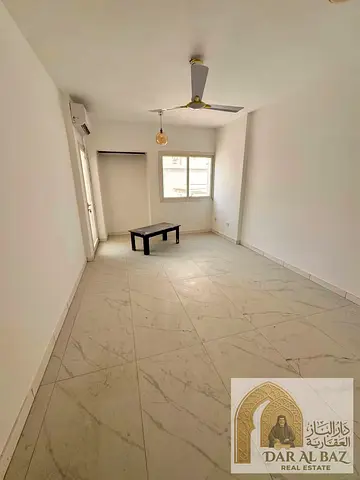 The best offer in Al Majaz 2: The largest 3-bedroom apartment with a huge living room, two balconies, and three bathrooms, available for annual rent a