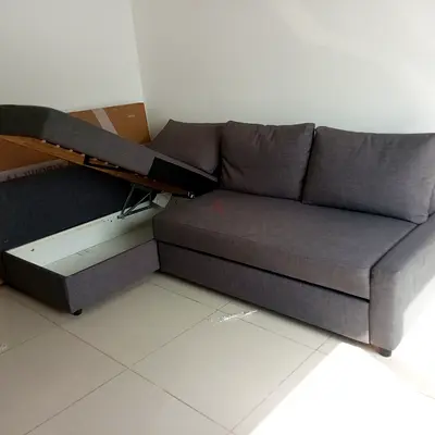 Grey L-shaped storage sofa bed - good condition