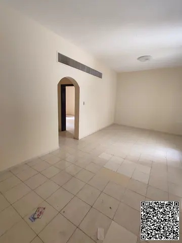 A spacious one-bedroom apartment with a balcony is available for rent in a prime location on the second row of Ajman Corniche. The apartment features