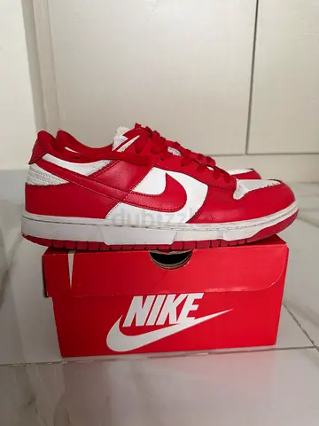 Red & White Nike Dunk Low sneakers, size not specified