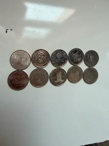 Collection of 11 Commemorative Coins - Assorted Designs