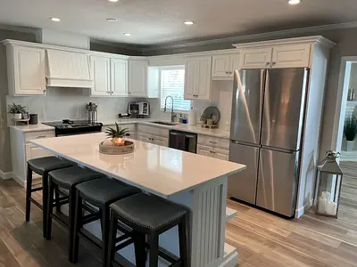 Modern White Kitchen with Large Island and  marble top with storage