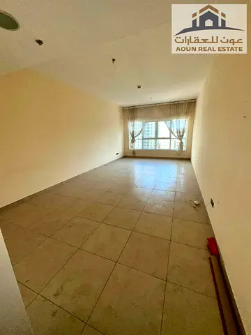 Two-bedroom apartment with a living room available for annual rent in the Asas Tower, Al Khan Corniche. Features include a balcony, swimming pool, gym