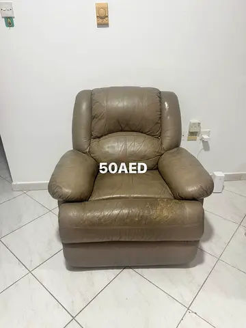 Used single leather recliner armchair - affordable, good for living room (50 AED)