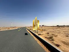 Residential land for sale in Sharjah, Rawdat Al Qurt area, second row from Street 97, freehold owner