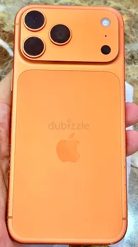 iPhone (orange skin) with triple-camera look - used back cover shown