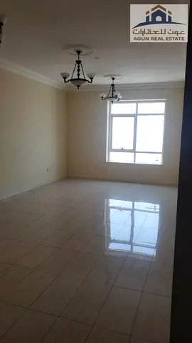 Two-bedroom apartment with a living room for annual rent in Al Majaz 2 – 3 bathrooms, free air conditioning.