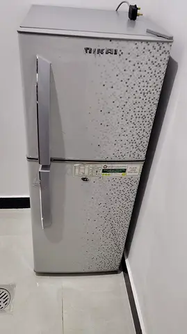 Medium-sized double-door refrigerator in good working condition
