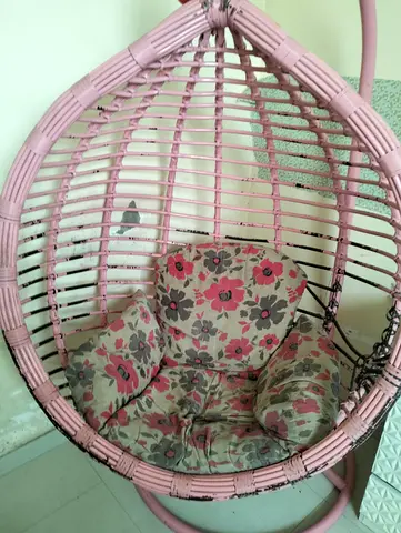 Pink Rattan Hanging Egg Chair with Floral Cushion