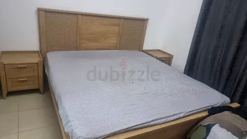 King-size wooden bed frame with matching bedside tables - light oak