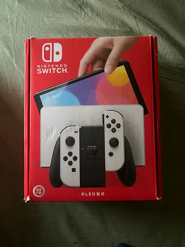 Nintendo Switch OLED (White) — Console in Original Box plus FREE GAMES AND A PRO CONTROLLER