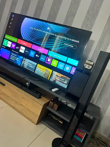 65-inch Smart LED TV with Soundbar and Tower Speakers - Good Condition