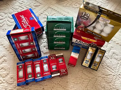 Mixed pack of new golf balls — Titleist, Titleist Pro V1, Noodle, Hickory