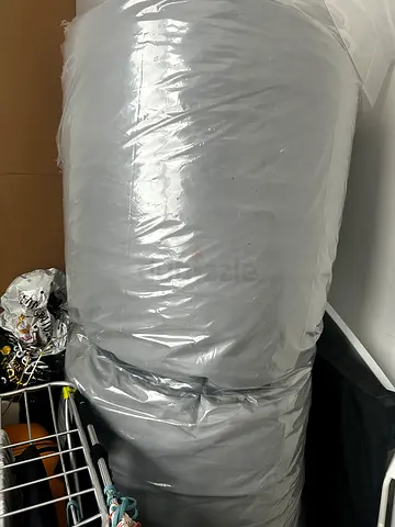 Rolled mattress in Protective Plastic Wrapping