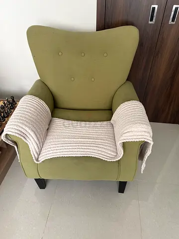 Comfortable olive-green accent armchair with removable throw for 2 chairs