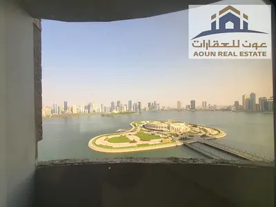 Two bedrooms and a living room with a view of Al Majaz Amphitheatre 3; includes 2 bathrooms, a laundry room, 2 balcony >parking >deposite 5%.