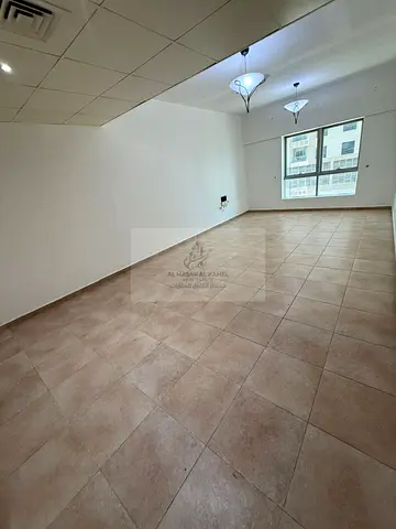 Spacious one-bedroom apartment with a comfortable living room in Al Majaz, located in a prime and c