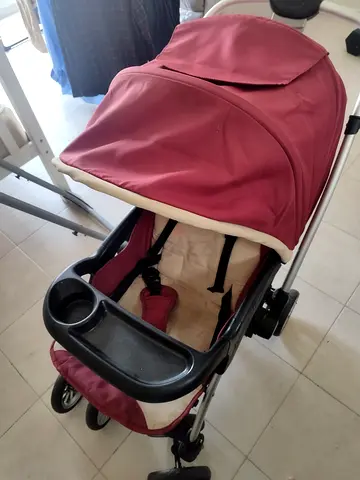Red lightweight baby stroller/pram in good used condition