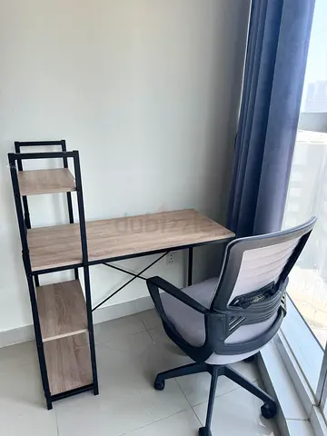 Compact wooden study desk with metal frame and storage shelves