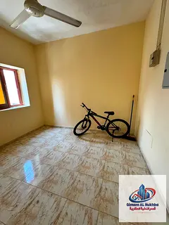 Studio in Al Majarra with separate kitchen, central AC & gas. AED 18K yearly, 4 or 6 payments.
