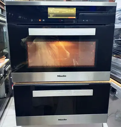 Miele \H6800BM/ Compact Combination Electric Oven And Miele ESW 6229/Warming Drawer Set.