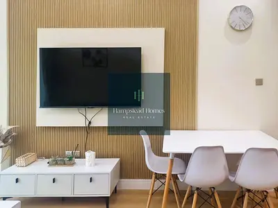 Canal-Front 1BR | Huge Terrace | Burj Views
