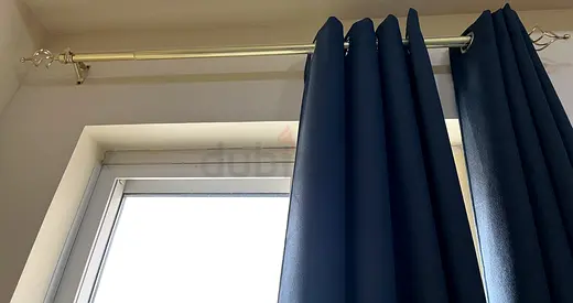 Dark blue blackout curtains with curtain rod