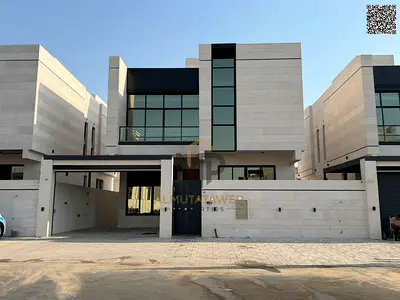 **Luxury villa for sale in Al Bahia - Ajman | Two floors + roof with modern design 5 master bedrooms with high-end finishes An ideal space for a life